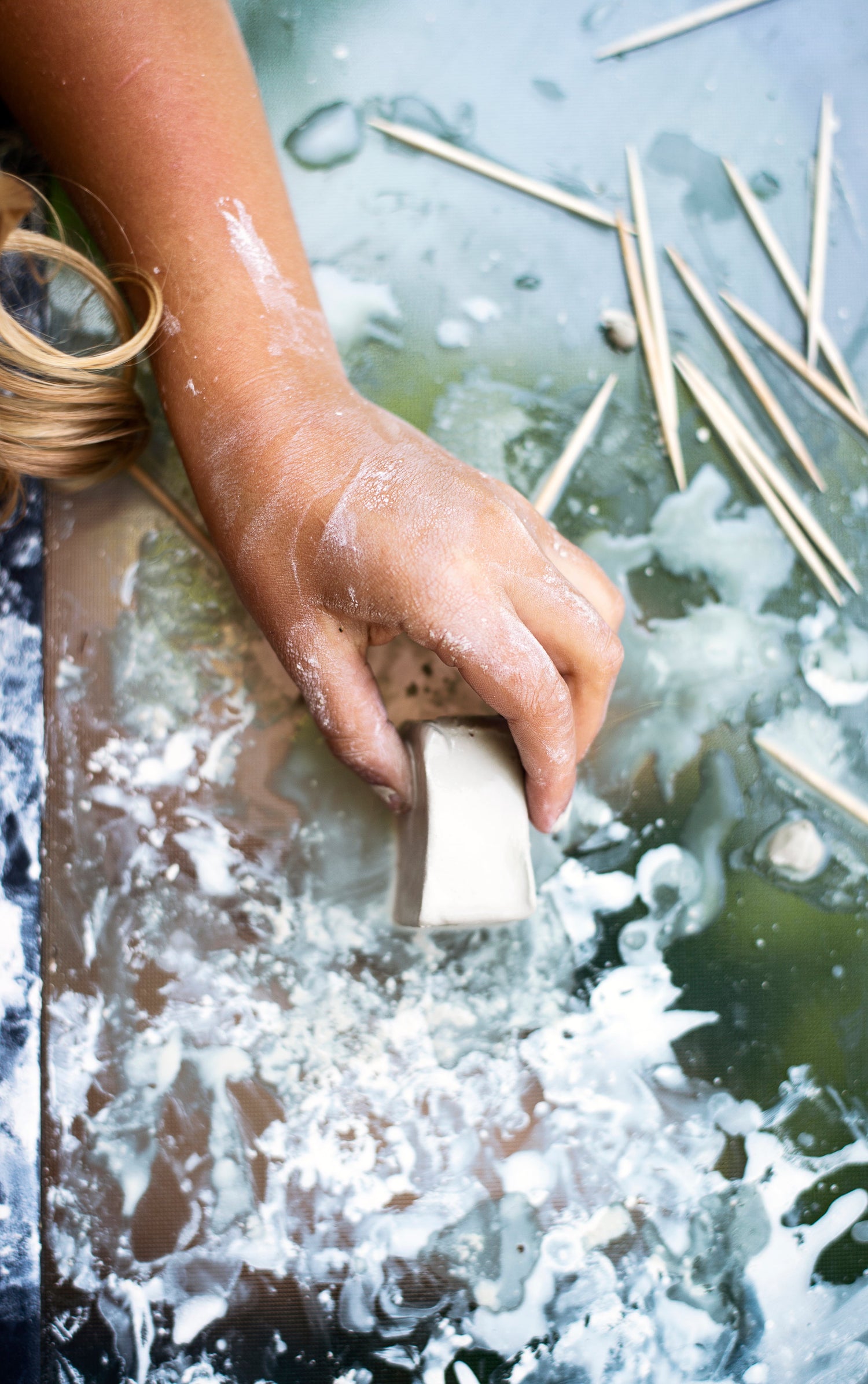 A hand Grabbing a Pottery Product